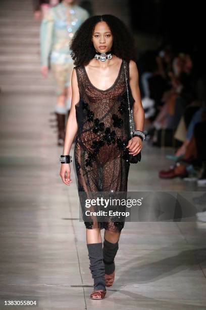 Model walks the runway during the Miu Miu Womenswear Fall/Winter 2022-2023 show as part of Paris Fashion Week on March 8, 2022 in Paris, France.