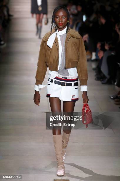 Model walks the runway during the Miu Miu Womenswear Fall/Winter 2022-2023 show as part of Paris Fashion Week on March 8, 2022 in Paris, France.