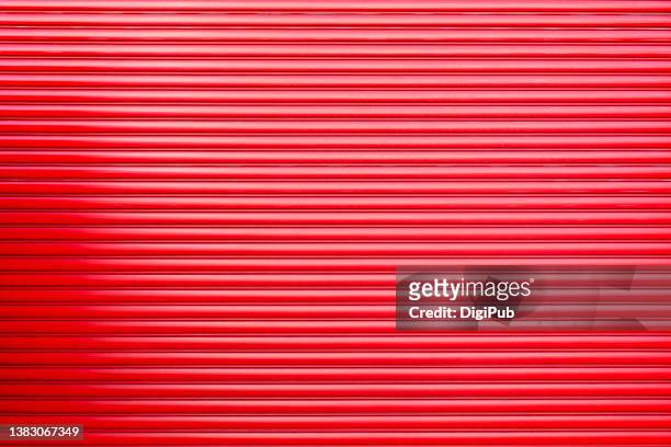 full frame red shutter, fire station garage - gerippt stock-fotos und bilder