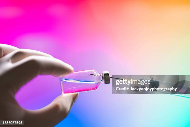 syringe inserted into a vaccine vial - immunotherapy stock pictures, royalty-free photos & images