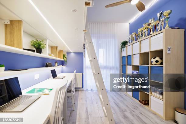 teenage boys nautical room with double desk and mezzanine bed. - trophy shelf stock pictures, royalty-free photos & images