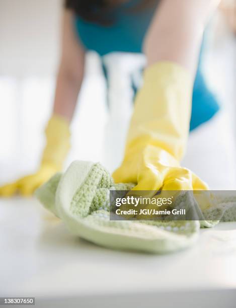 close up of korean woman wiping counter - straccio foto e immagini stock