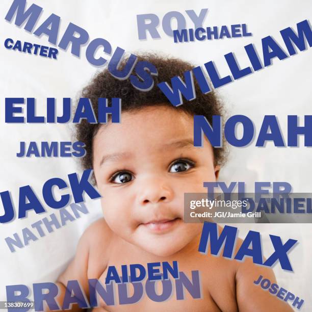 african american baby boy surrounded by boy's names - baby names stock-fotos und bilder