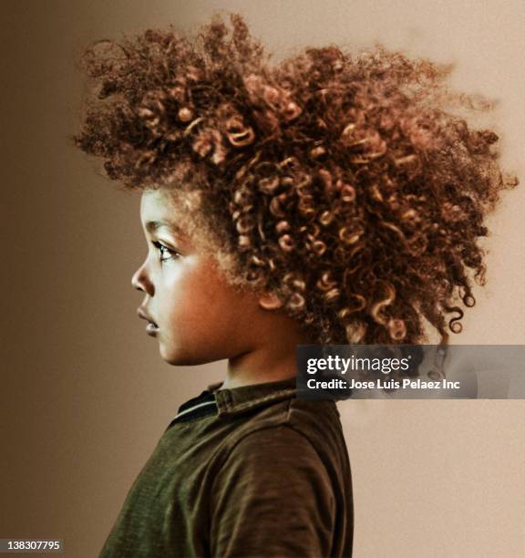 serious mixed race boy with curly hair - afro stock pictures, royalty-free photos & images