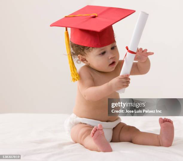Baby Cap And Gown Photos and Premium High Res Pictures - Getty Images