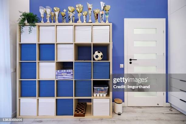 teenage boys room with double desk and mezzanine bed. - trophy shelf stock pictures, royalty-free photos & images