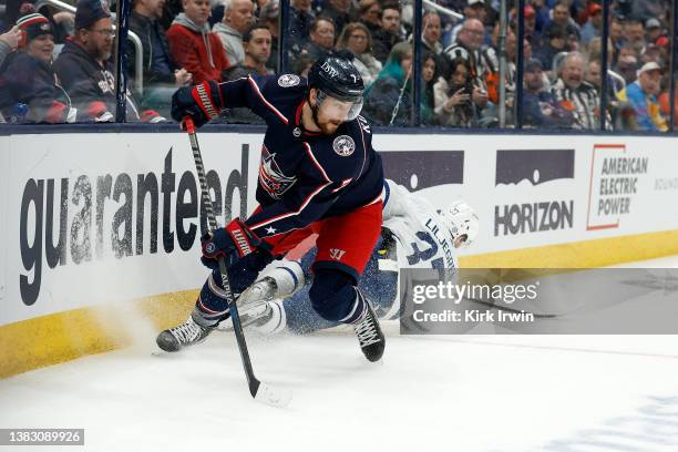 Sean Kuraly of the Columbus Blue Jackets skates after the puck during the game against the Toronto Maple Leafs at Nationwide Arena on March 7, 2022...