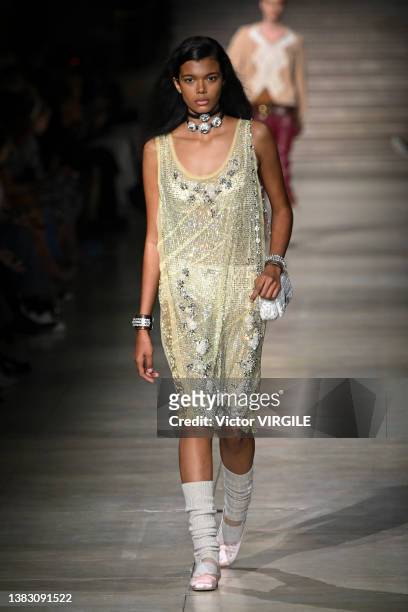 Model walks the runway during the Miu Miu Ready to Wear Fall/Winter 2022-2023 fashion show as part of the Paris Fashion Week on March 8, 2022 in...