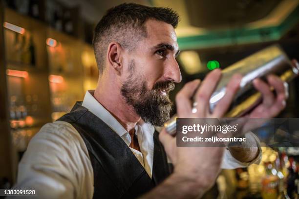 bartender preparing cocktails and coffee - bartender mixing drinks stockfoto's en -beelden