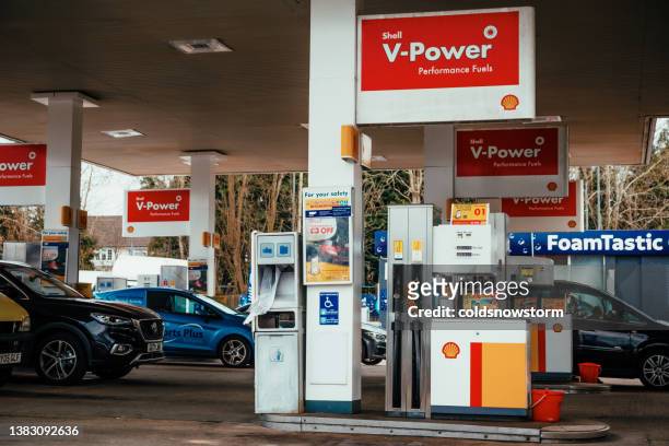 shell gas station forecourt - petrol forecourt stock pictures, royalty-free photos & images