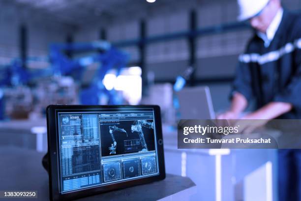 robot arm being tested by professional development engineer . - automático imagens e fotografias de stock