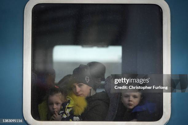 Refugees fleeing Ukraine arrive at the border train station of Zahony on March 08, 2022 in Zahony, Hungary. More than 2 million refugees have fled...