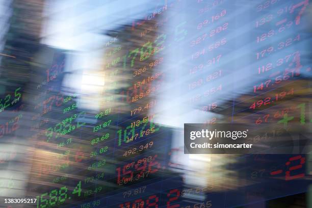 finance. blurred office buildings and trading screen data. - news ticker imagens e fotografias de stock