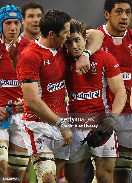 James Hook and Leigh Halfpenny of Wales celebrate at the final whistle after victory over Ireland in the RBS Six Nations match between Ireland and...