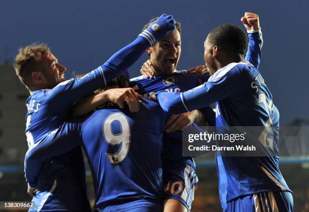 Juan Mata of Chelsea celebrates scoring his side's second goal with team mates Raul Meireles , Fernando Torres and Daniel Sturridge during the...