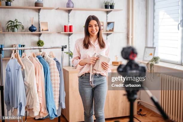 fashion blogger recording vlog about clothes - live event stock pictures, royalty-free photos & images