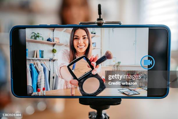 pretty young vlogger recording make up tutorial - beauty youtube stock pictures, royalty-free photos & images