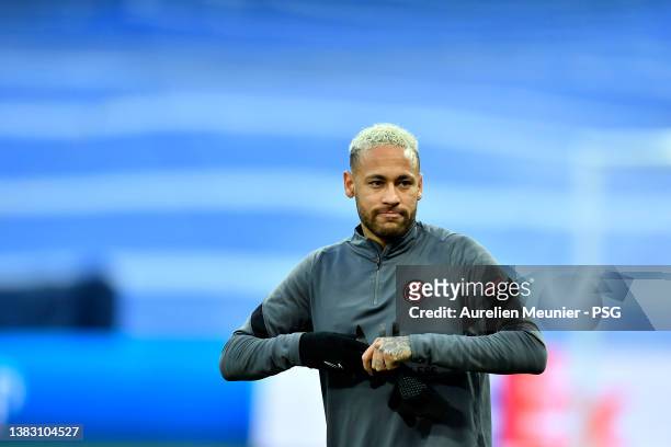 Neymar J of Paris Saint-Germain looks on during a training session at Estadio Santiago Bernabeu before the UEFA Champions League Round Of Sixteen Leg...