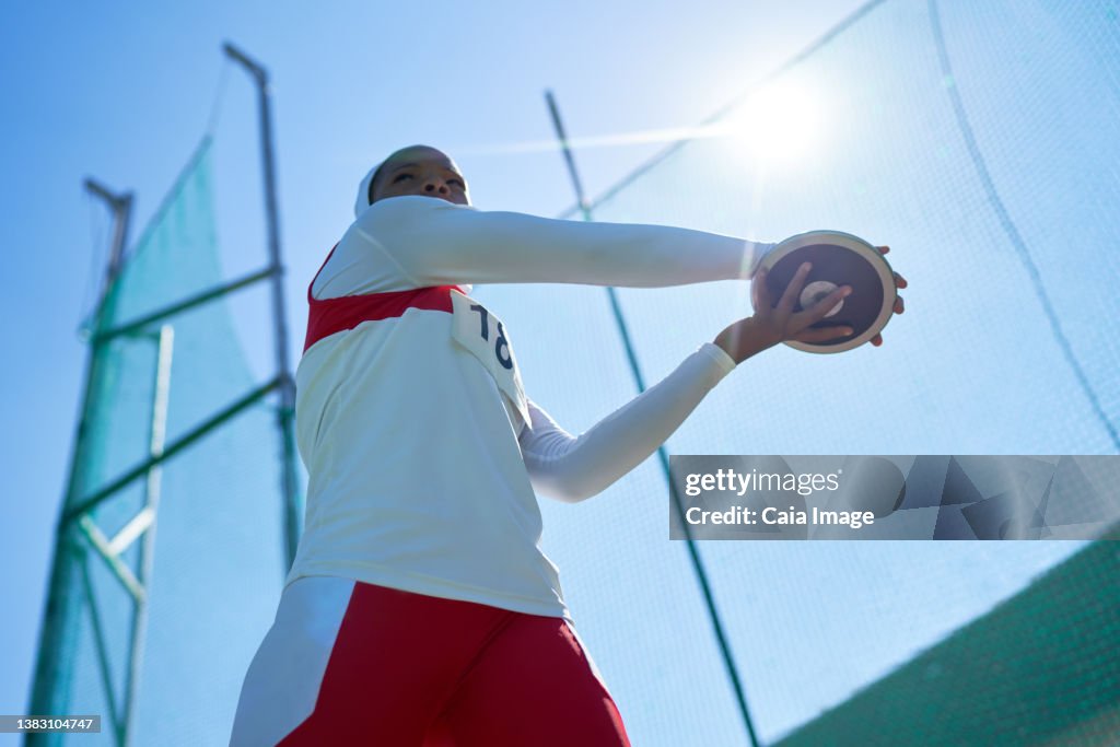Discus In Track And Field Female Track And Field Athlete Throwing Discus Under Sunny Blue Sky ...