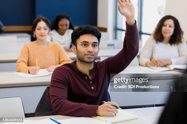 student raises hand - indian college stockfoto's en -beelden