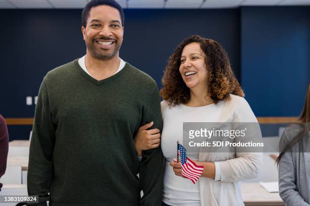 proud husband and wife - citizenship ceremony stock pictures, royalty-free photos & images