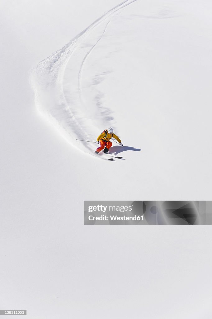 Austria, Young woman doing alpine skiing