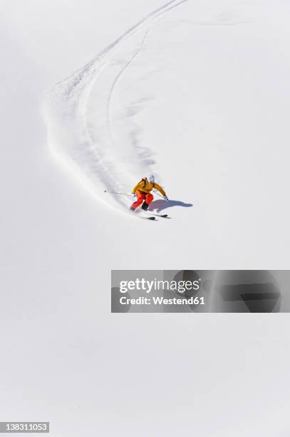 austria, young woman doing alpine skiing - female skier stock pictures, royalty-free photos & images