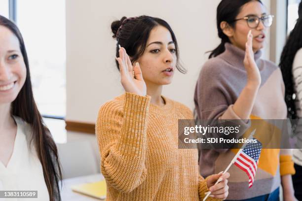 young women in citizenship class - cerimónia imagens e fotografias de stock