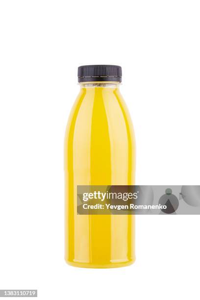 bottle of orange juice isolated on white background - bottle stockfoto's en -beelden