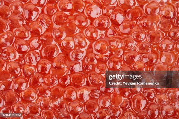 red caviar as a background - kaviaar stockfoto's en -beelden