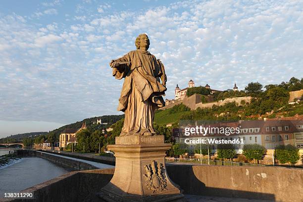 germany, bavaria, wuerzburg, view of statue and old main bridge - würzburg stock pictures, royalty-free photos & images