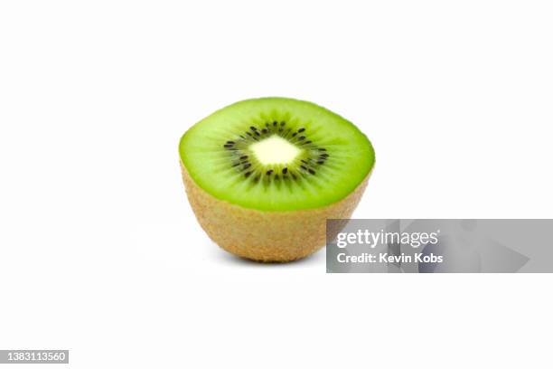 view of half a kiwi fruit. - kiwi fruit stock pictures, royalty-free photos & images