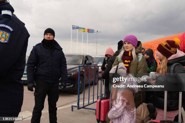 Ukrainian refugees prepare to get their passports checked at the border crossing in Romania, on March 8, 2022 in Isaccea, Romania. According to the...