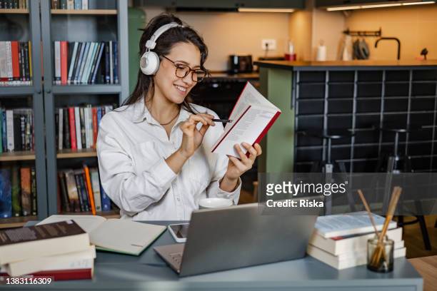 photo of young university student with books and laptop - summer job stock pictures, royalty-free photos & images