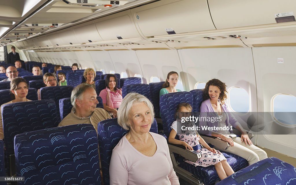 Germany, Munich, Bavaria, People in economy class airliner