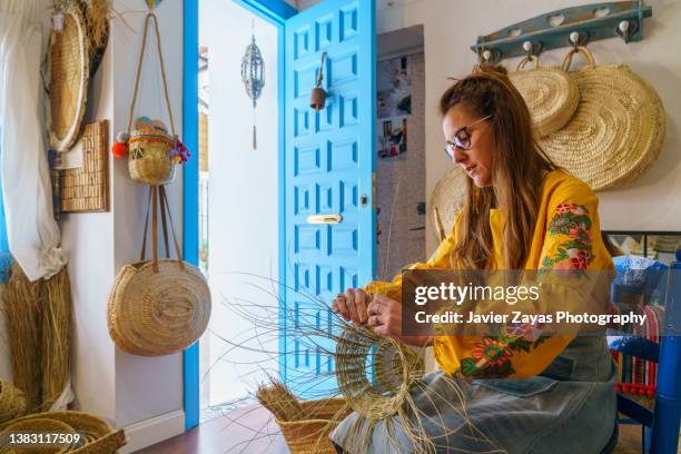 espartera woman working with esparto grass with his hands - basket weaving stock pictures, royalty-free photos & images
