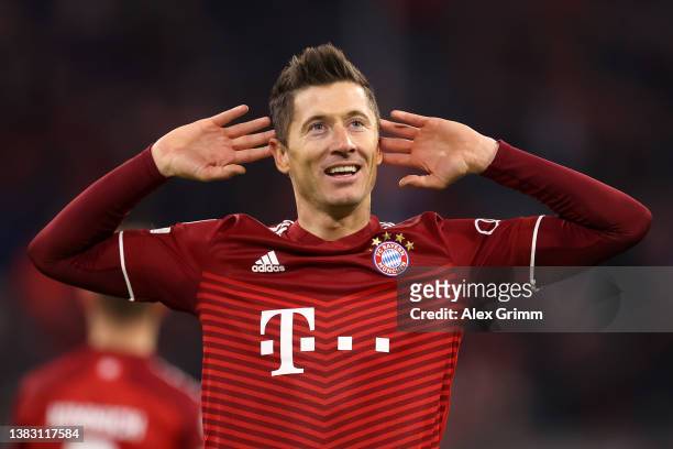 Robert Lewandowski of FC Bayern Muenchen celebrates after scoring their team's third goal during the UEFA Champions League Round Of Sixteen Leg Two...