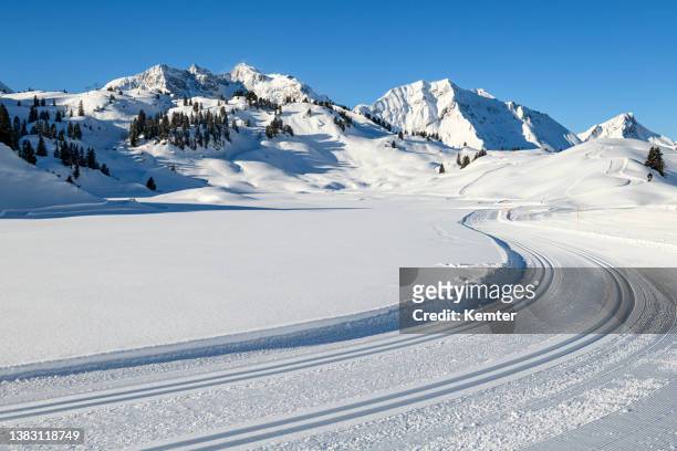 winter landscape with cross-country ski trail - cross country skiing stock pictures, royalty-free photos & images