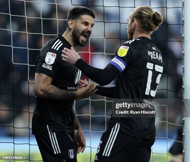 Aleksandar Mitrovic of Fulham celebrates scoring their sides first goal of the game with team mate Tim Ream during the Sky Bet Championship match...