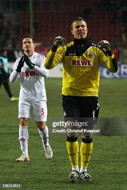 Sascha Riether and Michael Rensing of Koeln celebrate after the Bundesliga match between 1. FC Kaiserslautern and 1. FC Koeln at Fritz-Walter-Stadium...