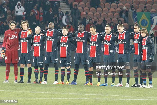 Paris Saint Germain players observe a minute's silence before the French Ligue 1 between Paris Saint Germain and Thonon Evian Gaillard at Parc Des...