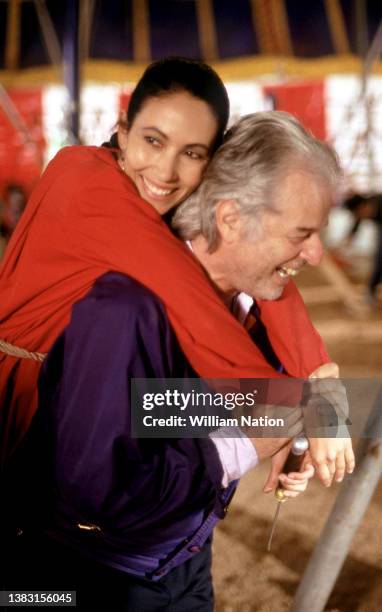 Chilean-French filmmaker and artist, Alejandro Jodorowsky carries Mexican actress, Blanca Guerra, on his back before filming a scene during the 1989...