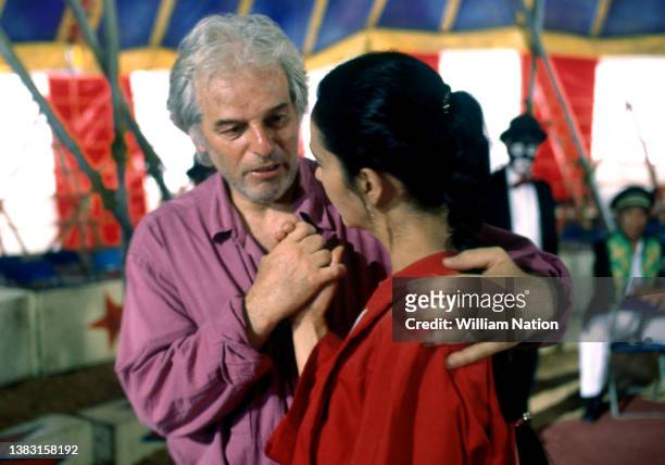 Chilean-French filmmaker and artist Alejandro Jodorowsky, talks to Mexican actress Blanca Guerra before filming a scene during the 1989 drama film...