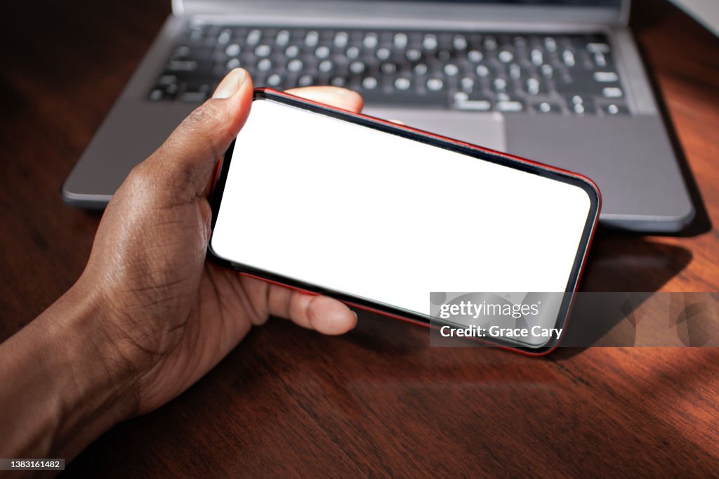 Woman Holds Smart Phone With Blank Screen