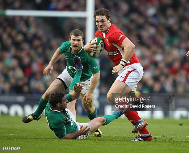 George North of Wales charges past Fergus McFadden and Gordon D'Arcy during the RBS Six Nations match between Ireland and Wales at the Aviva Stadium...