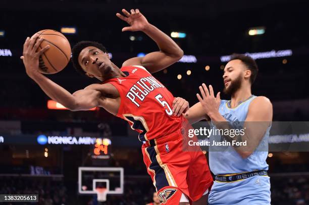 Herbert Jones of the New Orleans Pelicans controls the ball against Kyle Anderson of the Memphis Grizzlies at FedExForum on March 08, 2022 in...