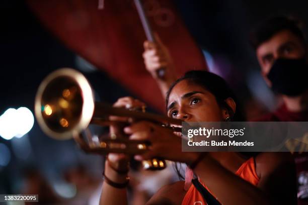 Woman plays the trompet during a demonstration as part of the International Women's Day on March 08, 2022 in Rio de Janeiro, Brazil.