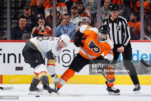Jack Eichel of the Vegas Golden Knights and Scott Laughton of the Philadelphia Flyers challenge for the puck during the second period at Wells Fargo...