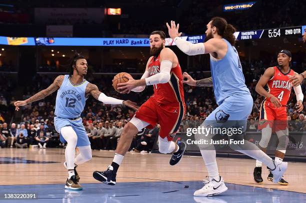 Jonas Valanciunas of the New Orleans Pelicans goes to the basket against Steven Adams of the Memphis Grizzlies during the first half at FedExForum on...