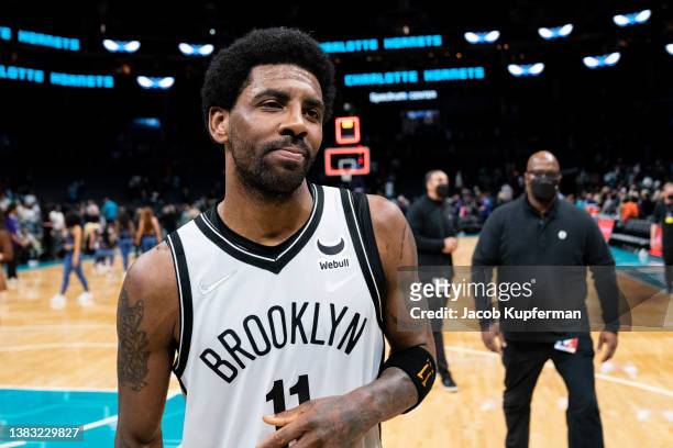 Kyrie Irving of the Brooklyn Nets walks off the court after scoring 50 points and defeating the Charlotte Hornets during their game at Spectrum...